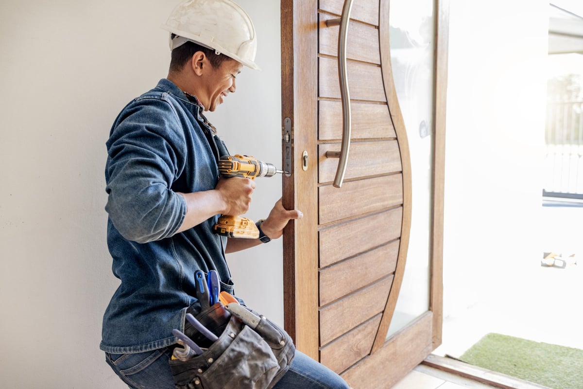 Craftsman installing a custom window combination